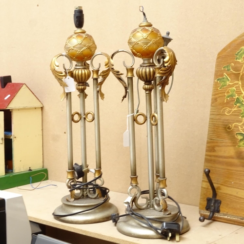 639 - A pair of silvered and gold painted Renaissance style table lamps, height excluding fitting 60cm