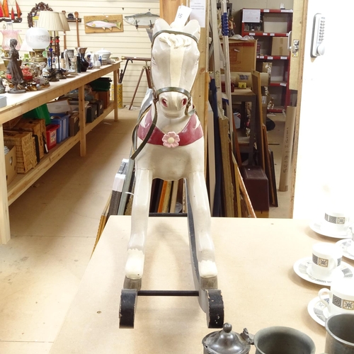 664 - Carved and painted wooden rocking horse, height 49cm