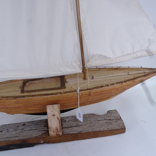 674 - A handmade model pond yacht sculpture, with masts and rigging, overall height 113cm