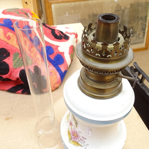 588 - A Vintage ceramic oil lamp with chimney, 47.5cm