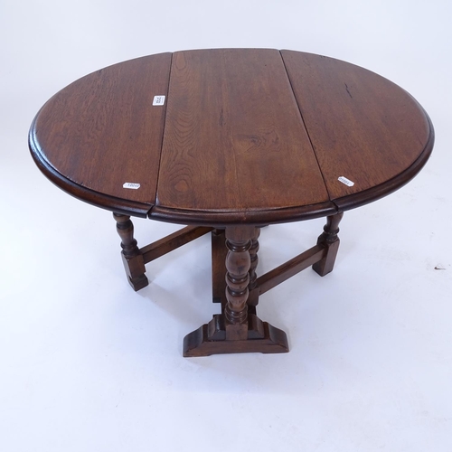 2011 - A small Ipswich style oak gateleg table on baluster legs, W61cm, H51cm, D25cm