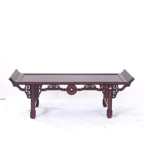 2057 - A Chinese hardwood low opium table, with carved and pierced frieze, L131cm, H45cm, D46cm