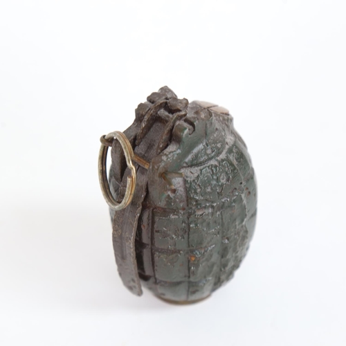 26 - A First World War Period Mills bomb inert hand grenade with pin and firing lever, no. 5 mark I