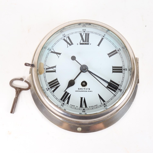 104 - A Smiths chrome-cased ship's bulkhead clock, white enamel dial with Roman numeral hour markers and b... 