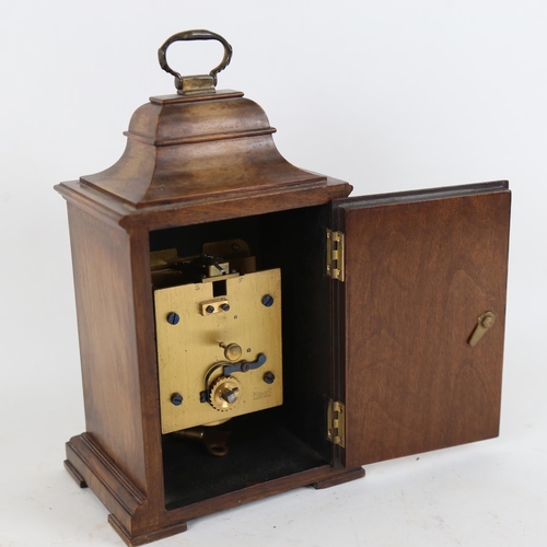 108 - A mid-20th century walnut-cased bracket clock, by Mercer of St Albans, brass dial with cast spandrel... 