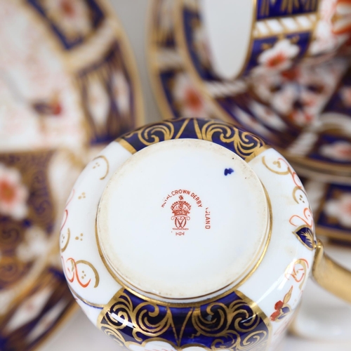 115 - A Royal Crown Derby tea and cake service for 12 people, including tea cups, saucers, cake plates, cr... 