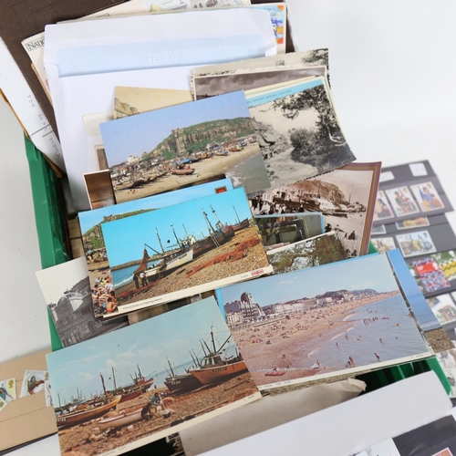 129 - A quantity of various loose topographical postcards, cigarette cards, postage stamps, First Day Cove... 