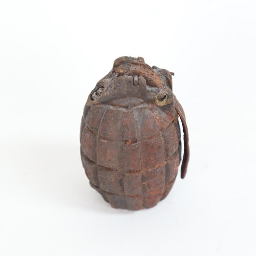 27 - A First World War Period Mills bomb inert hand grenade with pin and firing lever