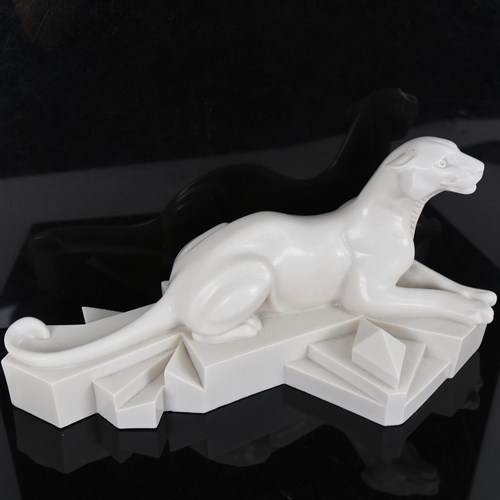 65 - After P Trudeau, an Art Deco style resin sculpture, recumbent panther on geometric base, signed, len... 