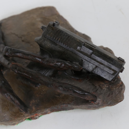 66 - Chris Watson, Raptor claw with gun, mixed media composition/slate, 10