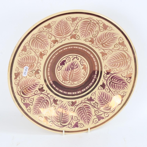 76 - WILLIAM DE MORGAN for WEDGWOOD - a purple lustre glazed pottery charger, floral decoration, Wedgwood... 