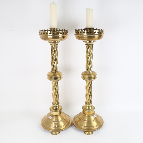 82 - A large pair of brass church Gothic candlesticks, height 57cm