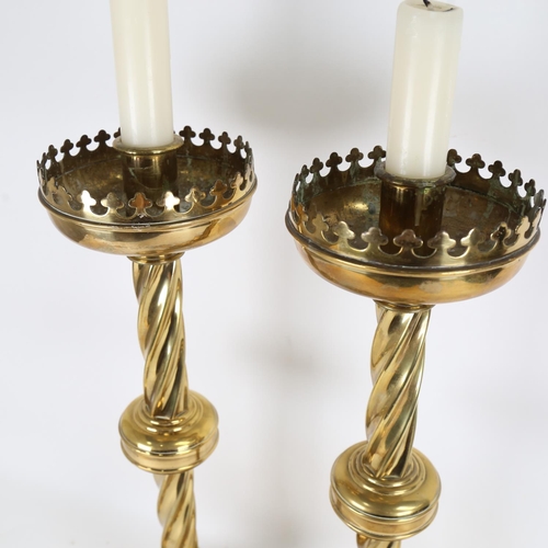 82 - A large pair of brass church Gothic candlesticks, height 57cm