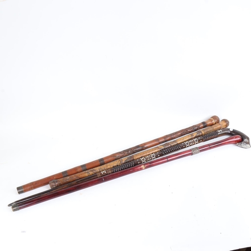 90 - 4 Oriental walking sticks, including lignum vitae and bamboo examples (4)