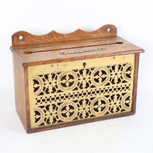 94 - An early 20th century brass-mounted oak wall-hanging letterbox, W26cm, H19cm, D13cm