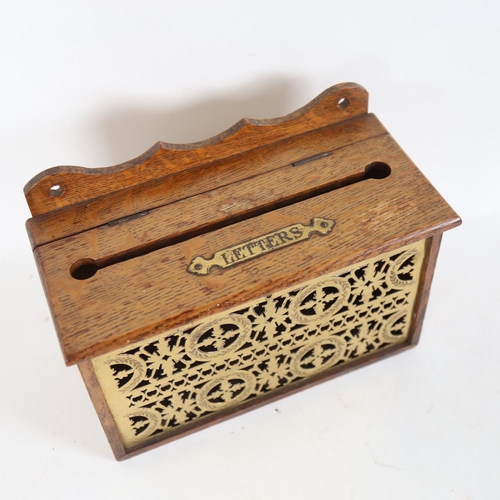 94 - An early 20th century brass-mounted oak wall-hanging letterbox, W26cm, H19cm, D13cm