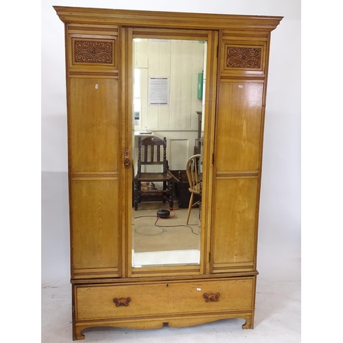 2171 - An Art Nouveau ash single mirror-door wardrobe, with drawer fitted base, W134cm, H206cm, D52cm