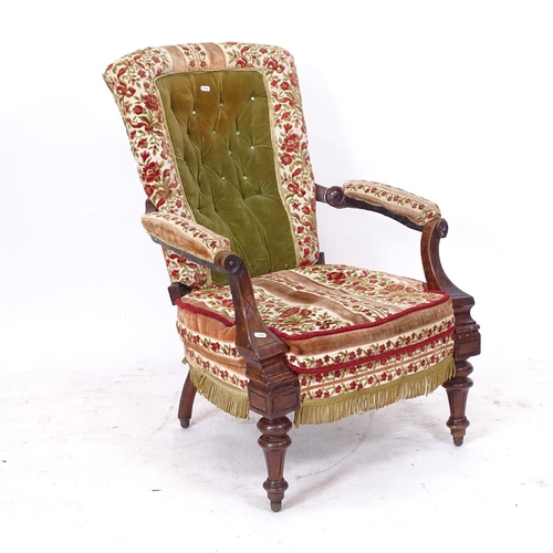 2174 - A Victorian walnut-framed and needlepoint upholstered open-arm chair