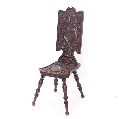 2235 - An Italian design carved and panelled hall chair, on turned legs