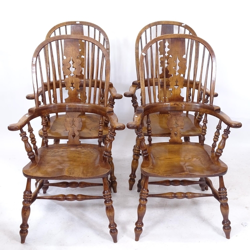 2240 - A set of 8 good quality reproduction oak and elm-seated bow-arm Windsor chairs