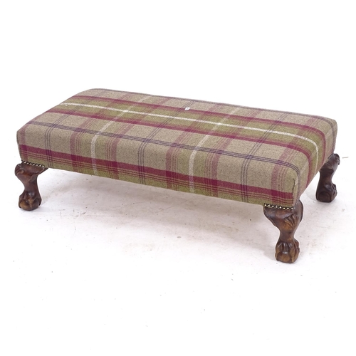 2242 - A rectangular upholstered footstool on claw and ball feet, W89cm, H29cm, D46cm