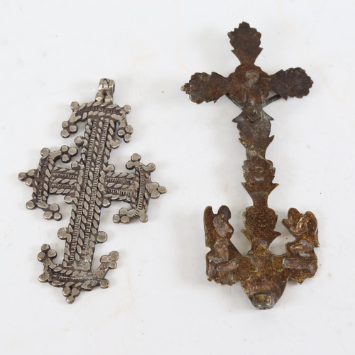 155 - An Ethiopian cross pendant, length 12cm, and a Continental relief cast-brass cross, height 16cm (2)