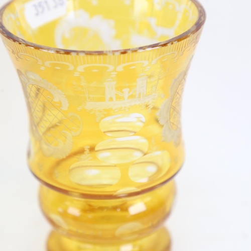 173 - A Bohemian flashed yellow glass overlay drinking glass, with etched decoration and polished pontil, ... 