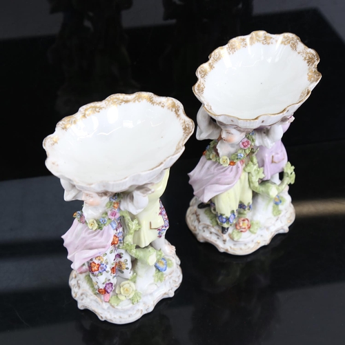 190 - A pair of Augustus Rex figural porcelain table salts, with hand painted figural and floral supports,... 