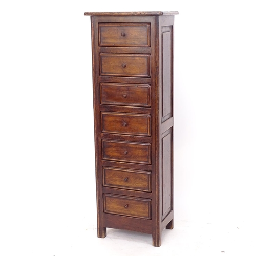 2260 - A panelled oak pedestal chest of 7 short drawers, W41cm, H118cm, D28cm