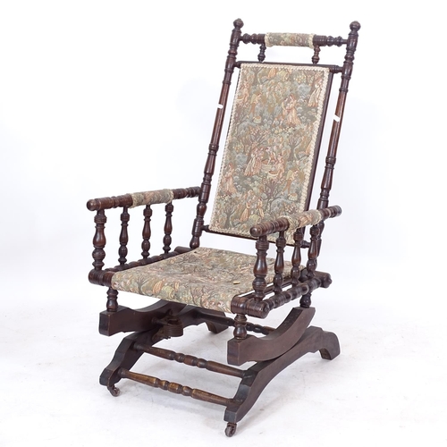 2289 - An American stained beech rocking chair, with tapestry upholstery