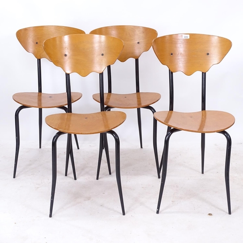 2294 - A set of 4 1980s plywood chairs, with shaped steel legs