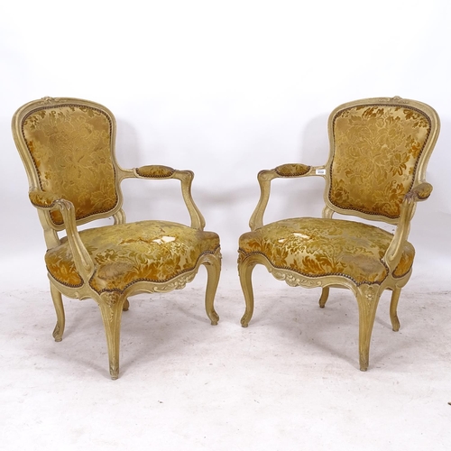 2332 - A pair of Continental cream painted open-arm salon chairs