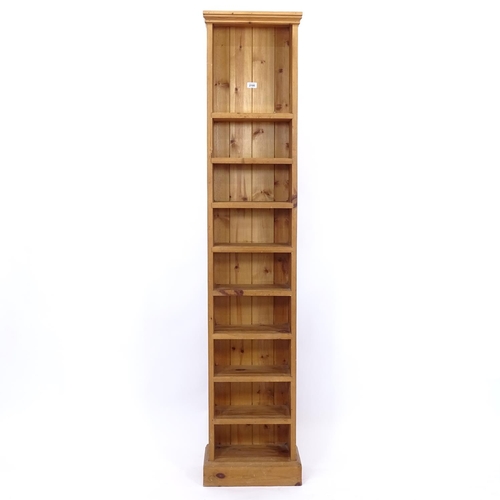 2195 - A narrow pine open bookcase, W37cm, H179cm, D21cm