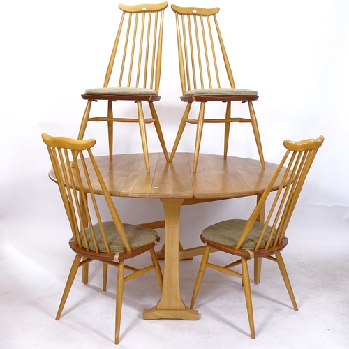 2214 - An Ercol 610 light elm drop leaf dining table on beech legs, together with a set of 4 matching Ercol... 