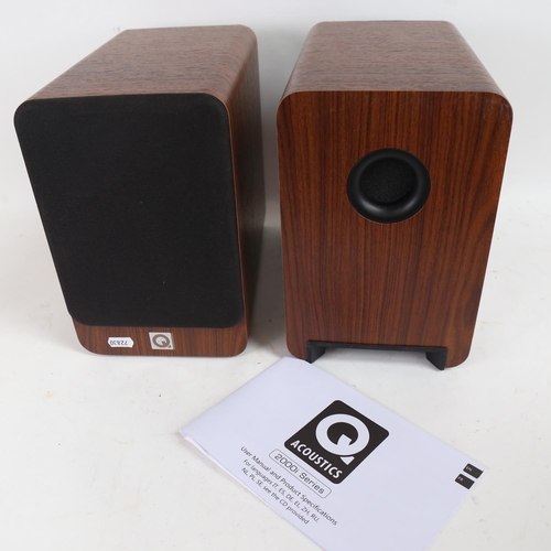 264 - Q ACOUSTICS - a pair of 2000i Series walnut bookshelf speakers, with user manual