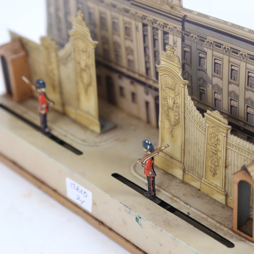 291 - An early 20th century lithograph tinplate clockwork toy diorama, the guard at Buckingham Palace, pro... 