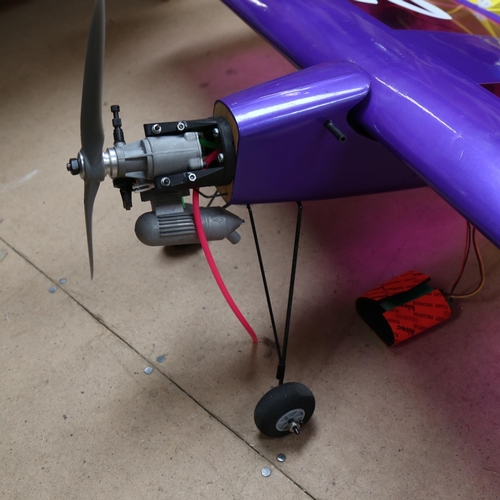 299 - A model radio-controlled Cougar 2000 plane, wingspan 128cm, with engines motors charger and control ... 