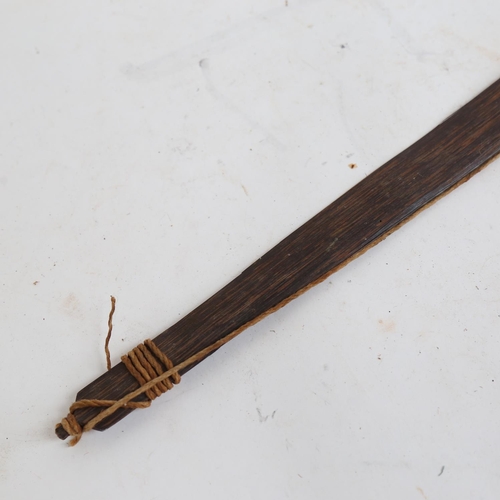 345 - A Tribal zebrano wood hunting bow, length 135cm