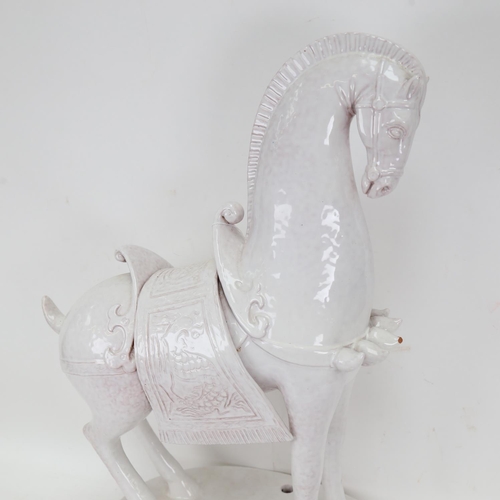 483 - An Italian pottery model of a Tang horse on plinth, height 53cm