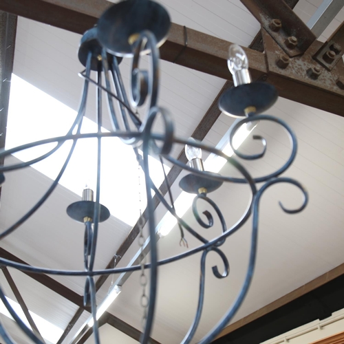 494 - A wrought-metal chandelier with 6 lights, diameter 55cm