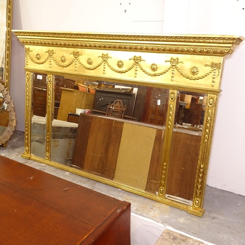 2507 - A modern gilt-framed triple bevel-edge over mantel mirror, with applied ribbon and swag decoration, ... 