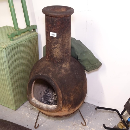 2513 - A terracotta chiminea on stand and cover, H78cm