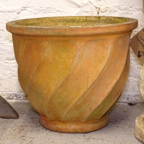 2521 - A large terracotta swirled garden pot, W52cm, H41cm