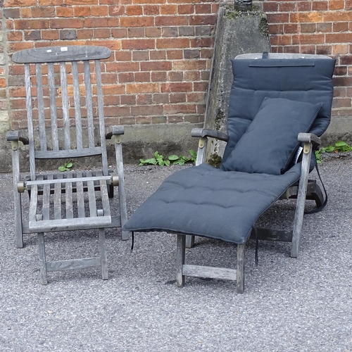 2525 - A pair of teak garden steamer chairs and cushions, label for Barlow Tyrie