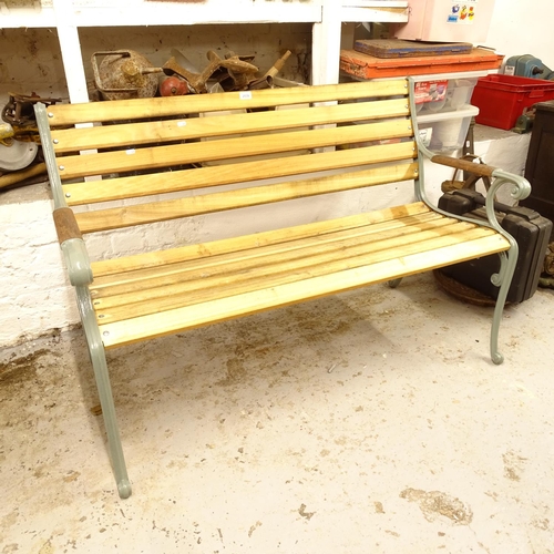 2539 - A painted iron-framed garden bench, with new slats, L130cm