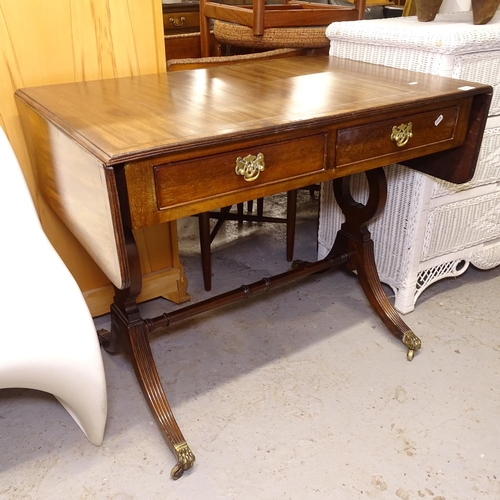 2557 - A mahogany and ebony-strung sofa table, with 2 frieze drawers, on lyre-end supports, W90cm, H75cm, D... 