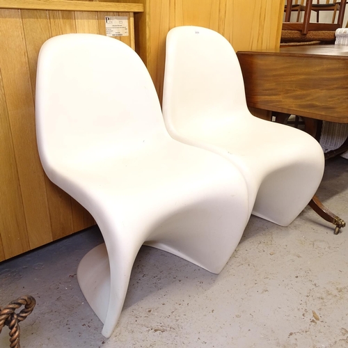 2559 - A pair of Panton chairs by Vitra, marked to the underside of the seat