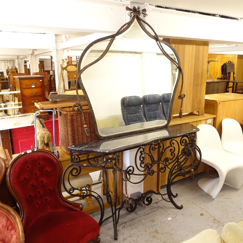 2560 - An ornate serpentine-front marble-top console table, on scrolled wrought-iron frame, with matching b... 