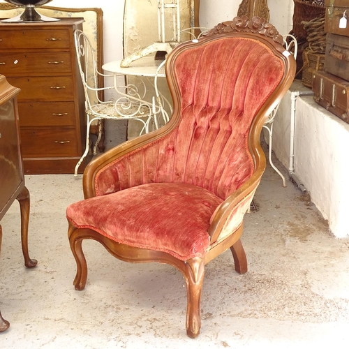 2562 - An upholstered and stained wood framed nursing chair