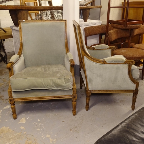 2575 - A pair of French upholstered armchairs, on fluted legs